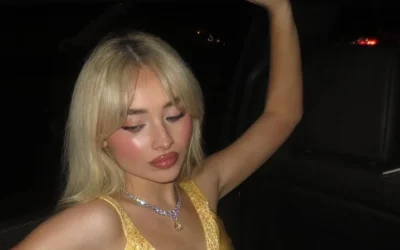 SABRINA CARPENTER’S YELLOW SATIN MINI DRESS IS GIVING ‘HOW TO LOSE A GUY IN 10 DAYS’